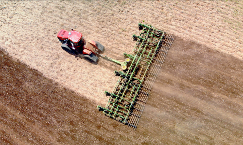 Tractor harvesting field 